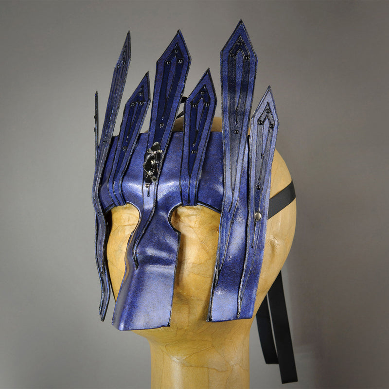 Black Diamond Midnight Blue Warrior Bauta Masquerade mask, with panel armor, metal findings and assorted polished gems. Inspired by medieval armor, this mask is particularly popular for men.  Handmade in the USA using traditional Venetian paper-mache technique. Lined with hypoallergenic stretch velvet for comfort. Side view.