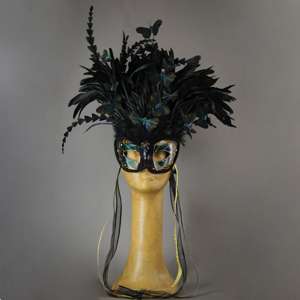 Beautiful Masquerade Mask, in iridescent shades over black. Crested with black coque feathers. Iridescent black feather butterflies flutter on the crest. Embellished with Swarovski crystals, and polished gemstones.  Hand made in the USA using traditional Venetian paper-mache technique. Lined with hypoallergenic stretch velvet for comfort.