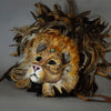 Stunning Lion Mask with a luxe crest of natural coque and assorted pheasant plumage. Embellished with Swarovski crystals, and assorted polished gem stones. Sure to turn heads at any costume, masquerade or Halloween party!  Hand-made in the USA using traditional Venetian paper-mache technique. Lined with hypoallergenic stretch velvet for comfort. Side view.
