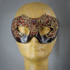 Ruby red lace masquerade mask with lacquered lace, Swarovski crystals and assorted polished gems.