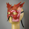 Bronze Warrior Bauta Masquerade mask, with panel armor, metal findings and assorted polished gems. Inspired by medieval armor, this mask is particularly popular for men.  Handmade in the USA using traditional Venetian paper-mache technique. Lined with hypoallergenic stretch velvet for comfort. Side view.