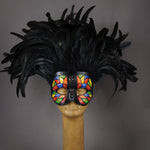 Beautiful Masquerade Mask, crested in Black coque feathers. Stained glass motif painted in rainbow colors and embellished with Swarovski crystals, dichroic glass and polished stones. Shades of red, orange, yellow, green and blue.  Hand made in the USA using traditional Venetian paper-mache technique. Lined with hypoallergenic stretch velvet for comfort.