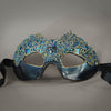 Simple, elegant eye mask in Metallic Turquoise Blue and Black. Embellished with lacquered lace, glass gems, Swarovski crystals and polished stones.  Hand made in the USA using traditional Venetian paper-mache techniques. Lined in stretch velvet for comfort. Detail.