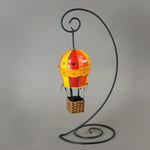 Handmade paper-mache balloon ornament in red, yellow and orange. Accented with metal findings and Swarovski crystals. Measures about 5" tall and 2.5" wide. Great for holiday or year-round display.