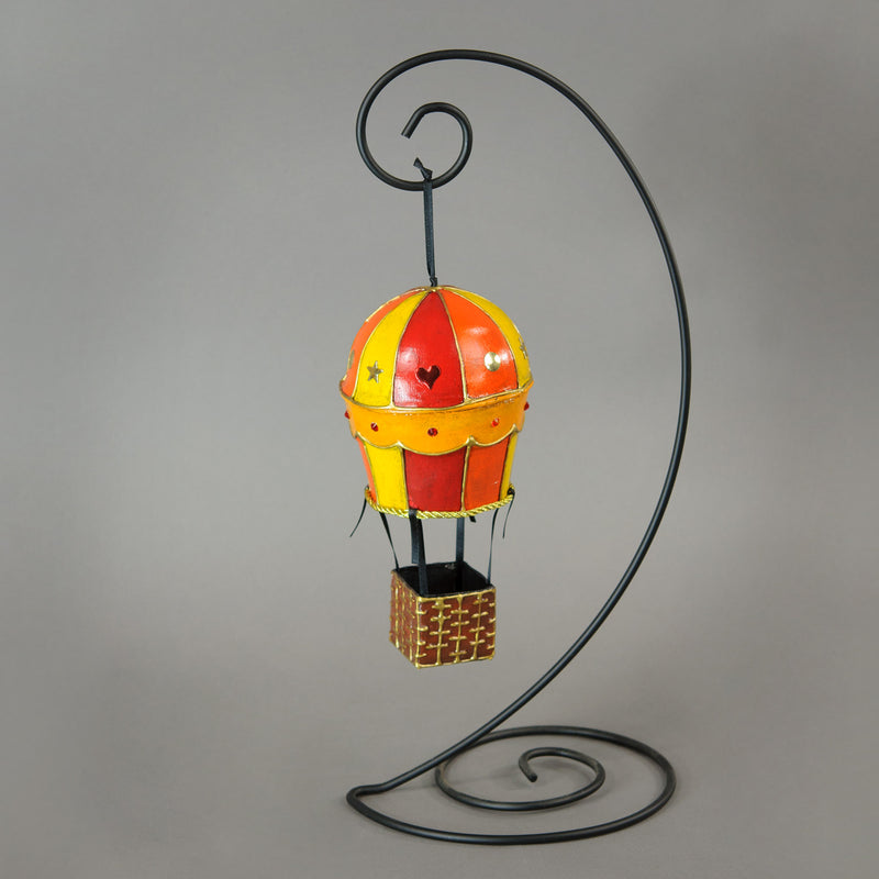 Handmade paper-mache balloon ornament in red, yellow and orange. Accented with metal findings and Swarovski crystals. Measures about 5" tall and 2.5" wide. Great for holiday or year-round display.