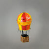 Handmade paper-mache balloon ornament in red, yellow and orange. Accented with metal findings and Swarovski crystals. Measures about 5" tall and 2.5" wide. Great for holiday or year-round display. Detail.